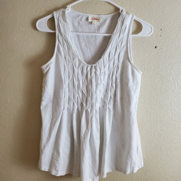 white sleeveless peplum top